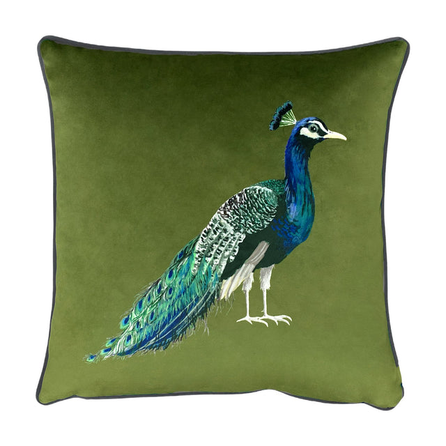 Square olive green velvet cushion with grey piped edge, featuring a printed peacock in profile with blue-green plumage and a long detailed tail, shown on a white background.