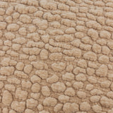 Close-up of the Pebble Linen Chenille Cushion in stone, showing raised, pebble-like chenille texture in a beige polyester pile.