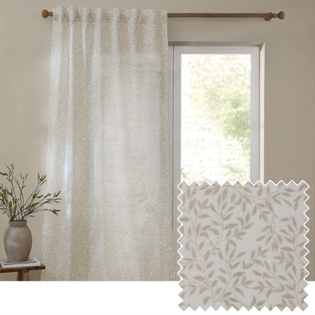 Perrie Leaf Floral Polyester Curtain Panel in natural, semi-sheer fabric with trailing leaf print, shown hanging by a window beside a fabric swatch and leafy vase in a neutral room.