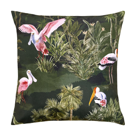 Platalea Jungle Polyester Cushion in Bottle Green, a 43 x 43cm square cover featuring pink spoonbills and painted storks among palms on a dark green ground, shown on a white background.