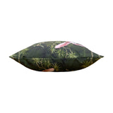 Side view of the Platalea Jungle polyester cushion in bottle green, showing a hand-illustrated tropical scene with pink spoonbills among palms, photographed against a plain white background.