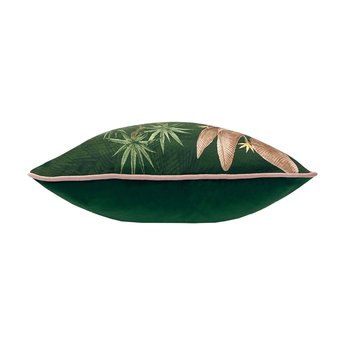 Platalea Botanical Velvet Cushion in green, side view showing plain green velvet back, pink piped edge, and botanical palm leaf print on front, plain white background.