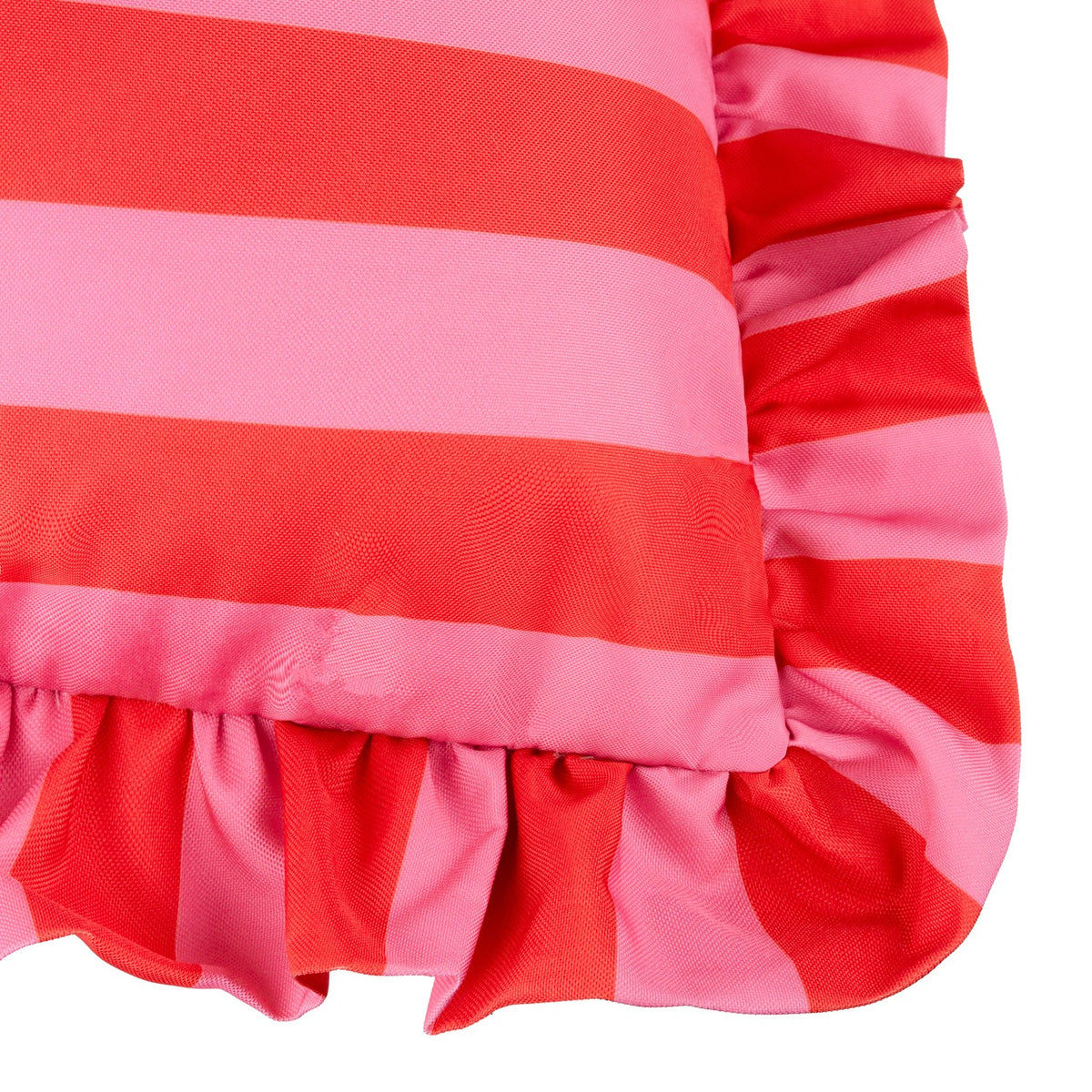 Close-up of the Palm Royale Stripe cushion in pink and red vertical stripes, showing the gathered ruffle trim continuing the striped pattern around the edge.