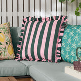 Palm Royale Stripe cushion in deep green and pink polyester with a ruffle trim edge, shown on a sofa alongside patterned cushions in an outdoor living setting.