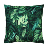 Square polyester cushion with a dense tropical leaf print in deep green and blue-green tones on a near-black ground, shown on a plain white background.
