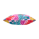 Side view of the Psychedelic Jungle Reversible Polyester Cushion, showing a piped edge with tropical leaf prints in pink, teal, coral and gold on a pink ground, set against a plain white background.