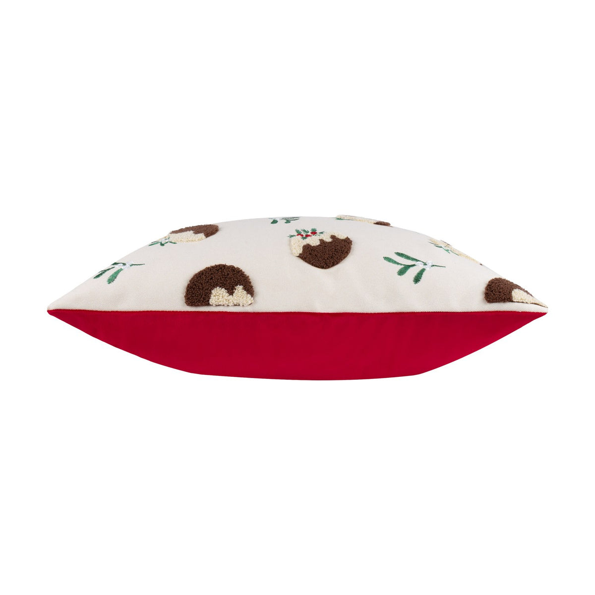 Side view of the Puddings Velvet Cotton Cushion showing cream velvet front with tufted Christmas pudding motifs and holly sprigs, paired with a plain red velvet reverse, on a white background.