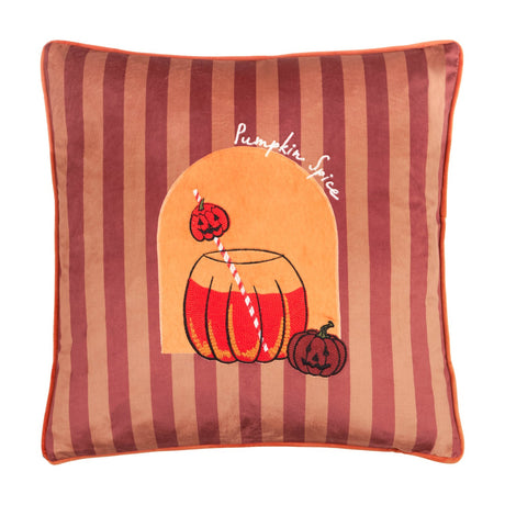 Square velvet cushion in berry and terracotta stripes with orange piping, featuring an embroidered pumpkin drink jar, striped straw, jack-o'-lanterns, and "Pumpkin Spice" script.