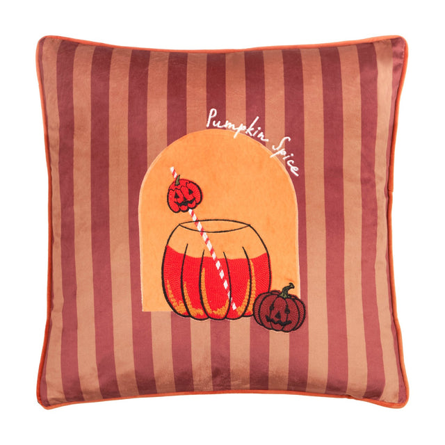 Square velvet cushion in berry and terracotta stripes with orange piping, featuring an embroidered pumpkin drink jar, striped straw, jack-o'-lanterns, and "Pumpkin Spice" script.