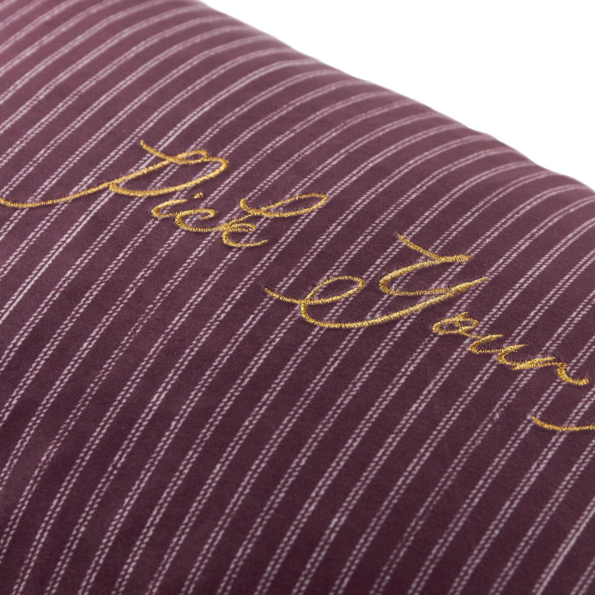 Close-up of the Pick Your Poison Striped Velvet Cushion in plum and mauve pinstripe velvet, with "Pick Your Poison" embroidered in gold metallic thread across the front.