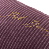 Close-up of the Pick Your Poison Striped Velvet Cushion in plum and mauve pinstripe velvet, with "Pick Your Poison" embroidered in gold metallic thread across the front.