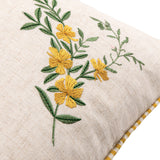 Rambbee Velvet Linen Cushion in natural oatmeal linen, corner detail showing embroidered yellow flowers on green stems against a plain background.