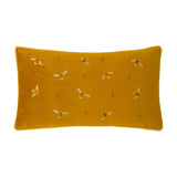 Rectangular honey gold velvet cushion with embroidered bees in cream and tan, small green leaf sprigs, and gingham-trimmed edging, shown on a plain white background.