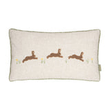 Rectangular Rambhar linen cushion in sage, 30 x 50cm, with three tufted leaping hares and embroidered flower sprigs on a natural flecked front, green gingham piping, plain white background.