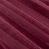 Close-up of Regency Stripe eyelet curtain fabric in burgundy velvet, showing folds with a subtle self-stripe and light-catching pile texture.