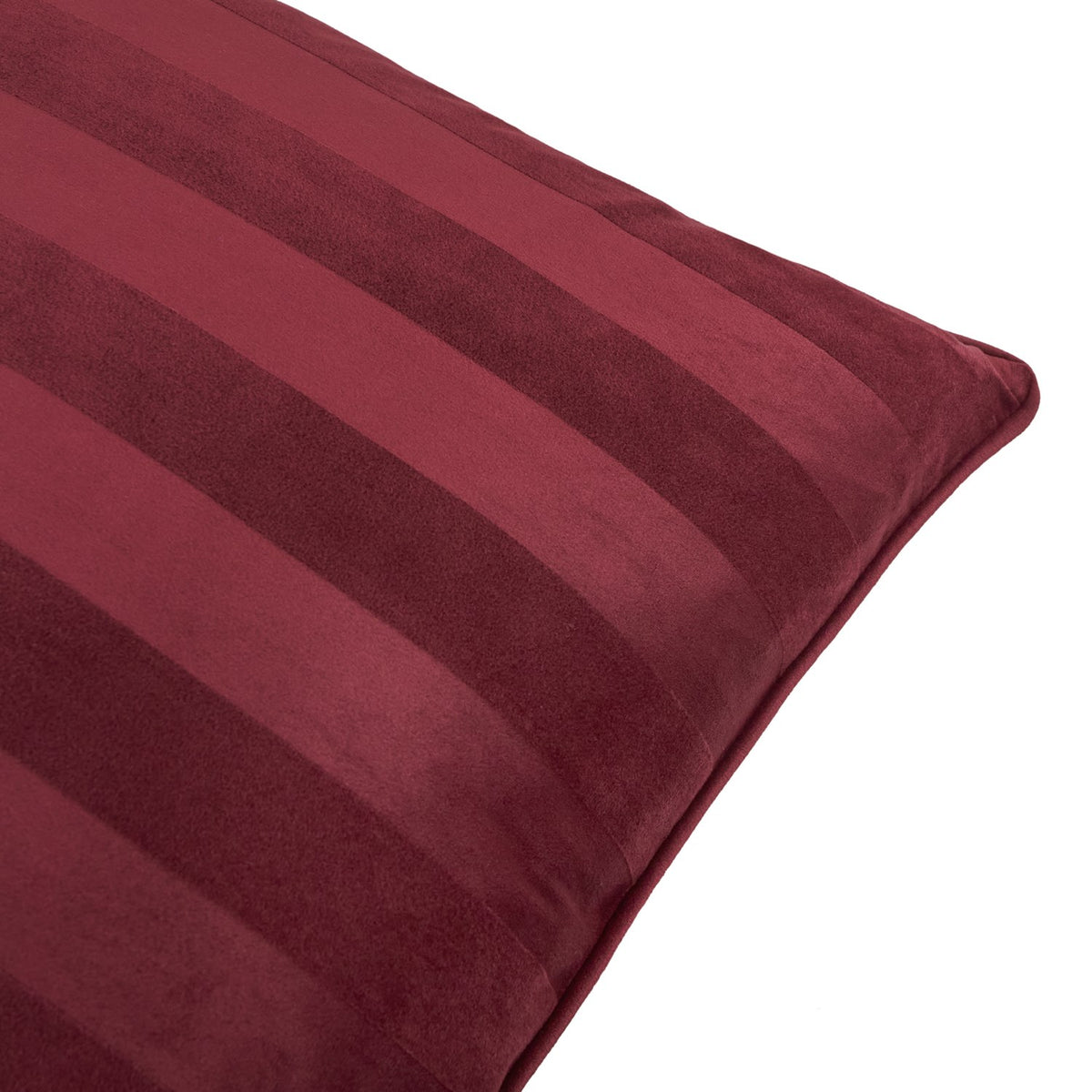 Close-up of the Regency Stripe Jacquard Velvet Cushion in burgundy, showing matt and sheen striped pile with piped edge, on a plain white background.