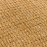 Close-up of the Ribble Reversible Cotton Cushion in honey, showing the finely textured, ribbed cotton weave in a warm, stonewashed yellow-brown tone.