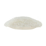 Side view of the Rowan Faux Fur Plain Velvet Cushion in ecru, showing the shaggy sheepskin-style pile on top and smooth velvet base, set against a plain white background.