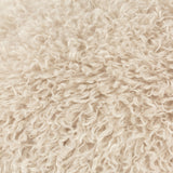 Close-up of the Rowan Faux Fur Polyester Velvet Cushion in natural cream, showing its shaggy, curly-pile texture reminiscent of Mongolian sheepskin.