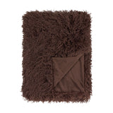Rowan Velvet Faux Fur Throw in chocolate brown, shaggy Mongolian-style pile with a folded corner revealing the smooth velvet reverse, shown on a plain white background.