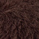 Close-up of the Rowan Velvet Faux Fur Throw in chocolate brown, showing the long, curling shag pile texture of the polyester front.