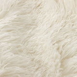Close-up of the Rowan Faux Fur Plain Velvet Throw in ecru, showing the shaggy faux Mongolian fur texture in soft off-white cream.