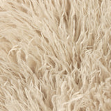 Close-up of the Rowan Faux Fur Plain Velvet Throw in natural beige, showing the long, shaggy Mongolian-style faux fur pile texture on the face side.