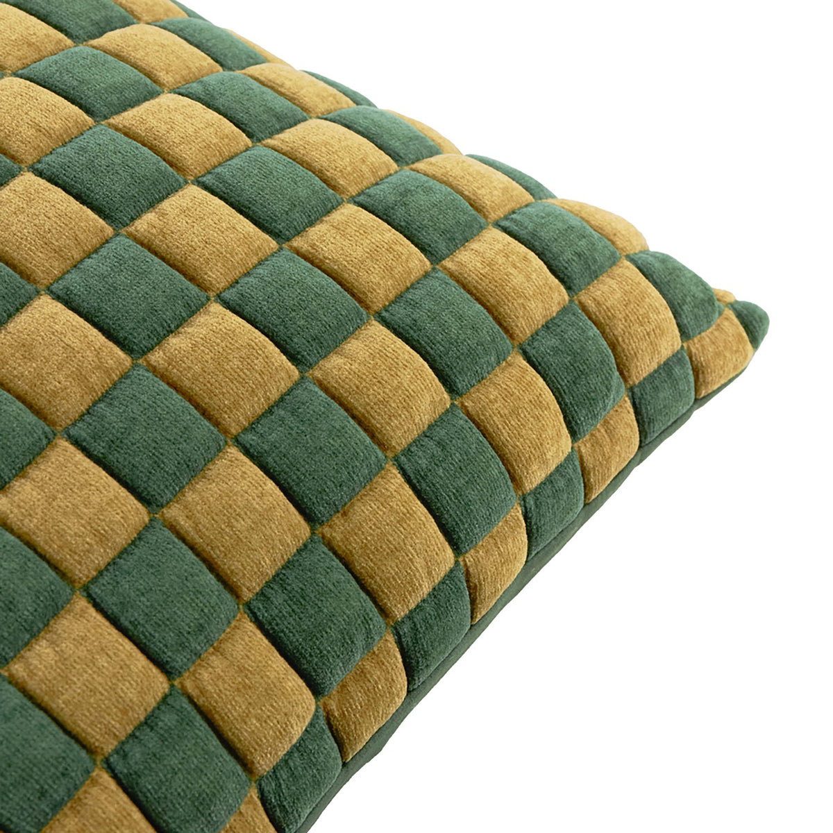 Close-up of the Softie Check cushion in green and amber-gold, showing a quilted checkerboard pattern with raised polyester squares, on a plain white background.