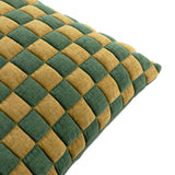 Close-up of the Softie Check cushion in green and amber-gold, showing a quilted checkerboard pattern with raised polyester squares, on a plain white background.