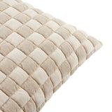 Close-up of the Softie Check cushion showing its raised quilted checkerboard face in alternating beige and ivory-cream tones, set against a plain white background.