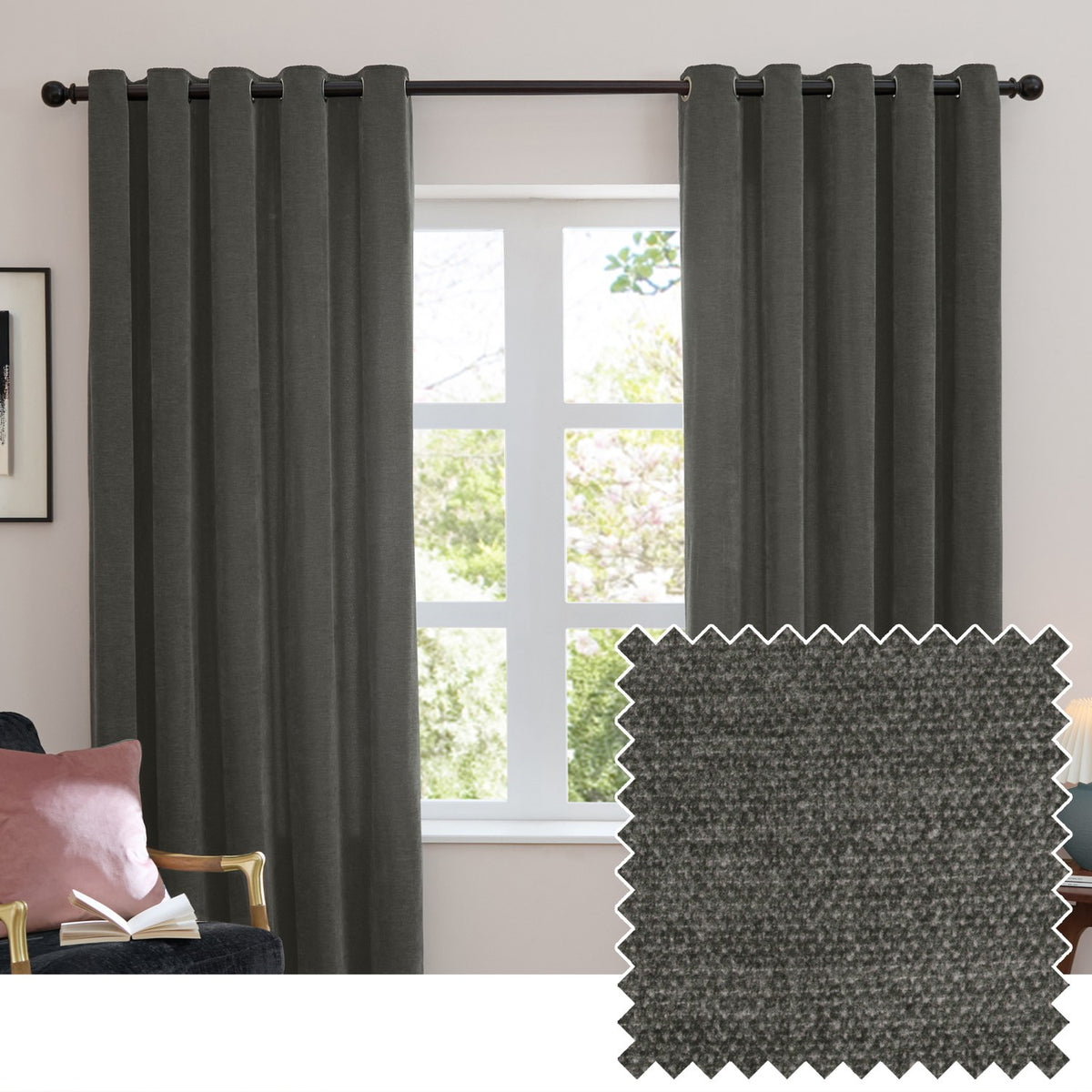 Charcoal grey eyelet curtains in soft chenille fabric hang from a dark rod either side of a window in a living room, with a fabric swatch shown inset.