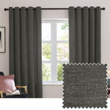 Charcoal grey eyelet curtains in soft chenille fabric hang from a dark rod either side of a window in a living room, with a fabric swatch shown inset.