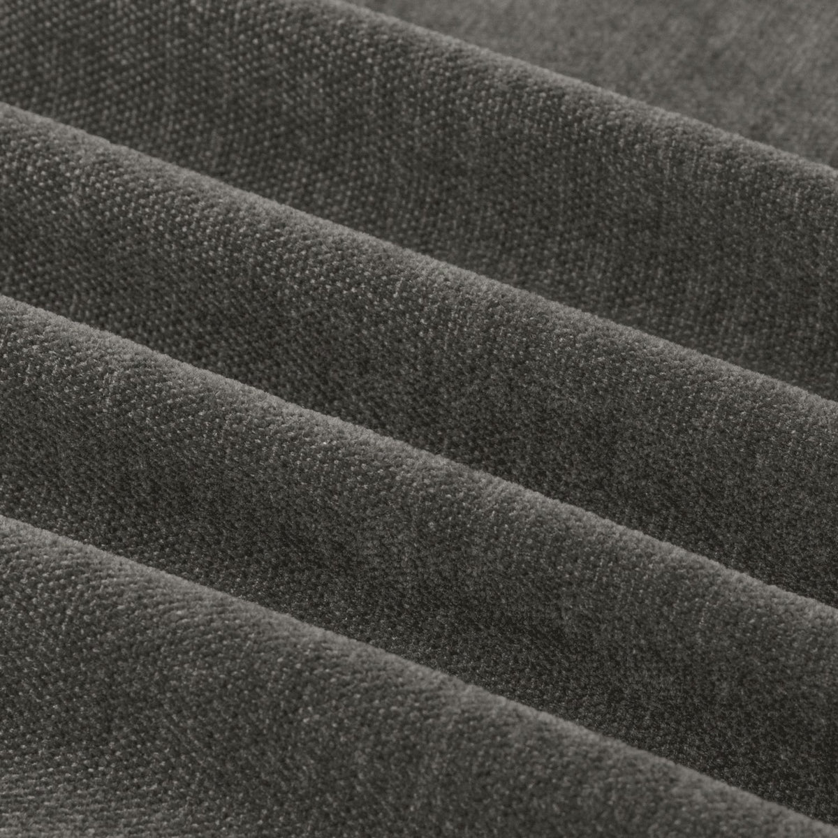 Close-up of Soft Chenille Plain Lined Eyelet Curtains in charcoal, showing the soft matt pile texture and fabric folds in a dense woven finish.