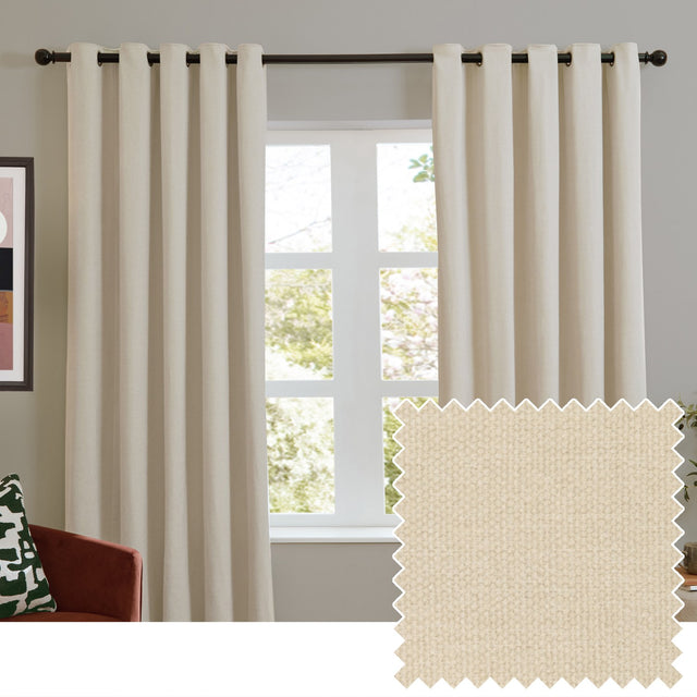 Ecru chenille eyelet curtains hung on a dark rod in a living room window, shown with a swatch of the plain, softly textured fabric.