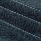 Close-up of Soft Chenille Plain Lined Eyelet Curtains in navy, showing folded fabric with a matte, velvety woven texture in deep blue.