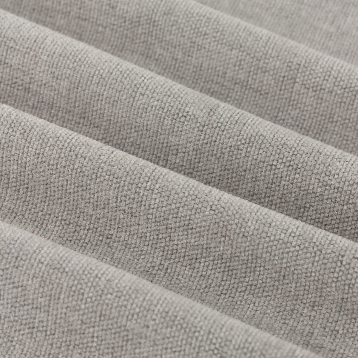 Close-up of Soft Chenille Plain Lined Eyelet Curtains in silver grey, showing the woven chenille texture and soft folds of the fabric.