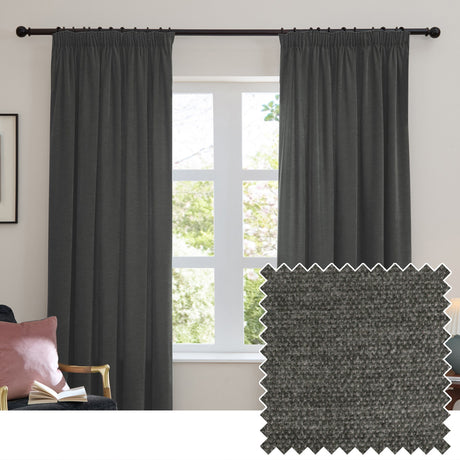 Charcoal chenille pencil pleat curtains hung on a black rail in a living room window, shown with a matching grey textured fabric swatch.