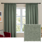 Green pencil pleat curtains in soft chenille fabric hung on a black rod in a living room, shown with a matching textured fabric swatch beside a window.