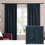 Navy chenille pencil pleat curtains hanging either side of a window in a living room, with a fabric swatch inset showing the textured woven polyester finish.
