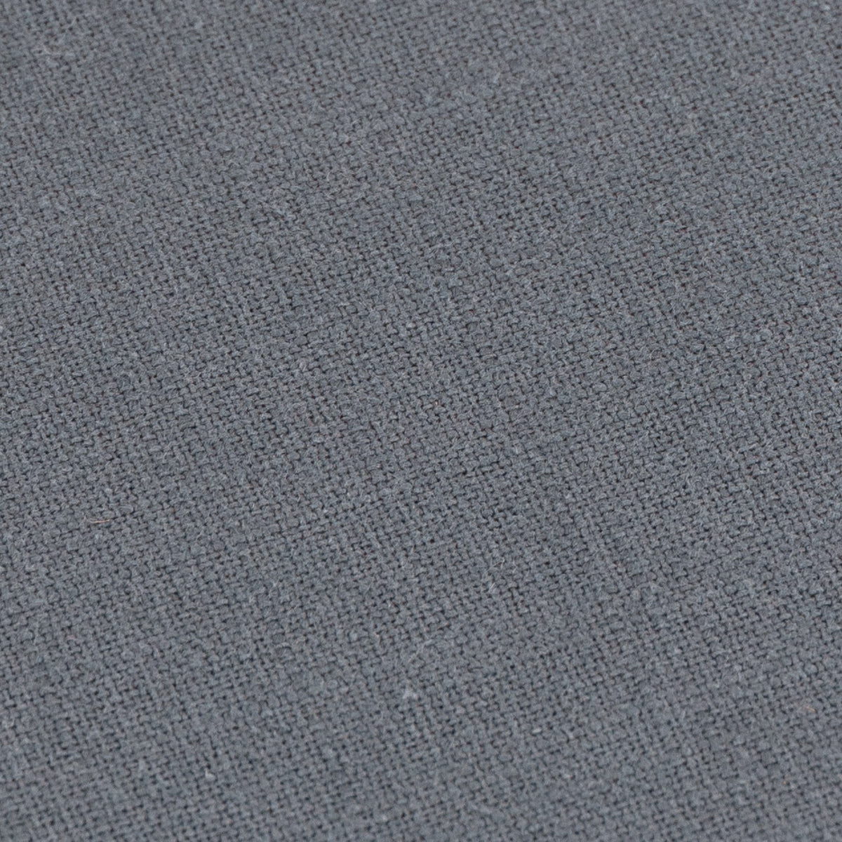 Close-up of the Slub Cotton Woven Plain Cushion in denim blue, showing the woven texture of the 100% slub cotton fabric.