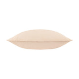 Slub Cotton Plain Linen Cushion in cream with a faint pinkish undertone, shown side-on to reveal its plump shape and piped edge seam against a white background.