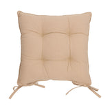 Square beige slub cotton seat pad with piped edge and button-tufted centre, fitted with tie straps at the base corners, shown on a plain white background.