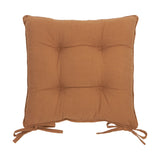Square slub cotton seat pad in toffee brown with tufted button detailing and tie fastenings, shown on a plain white background.