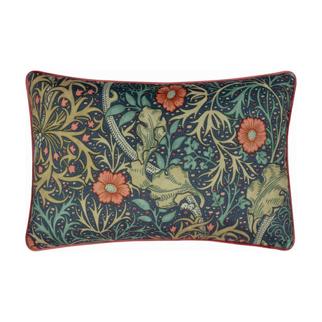 Rectangular velvet cushion in indigo with a printed Seaweed floral design of coral-red flowers, green leaves and stems, finished with coral piping, shown on a plain white background.