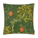 Square polyester cushion in Morris & Co.'s Seaweed Floral design, forest green ground with sage and gold foliage and coral-orange daisy blooms, shown on a plain background.
