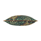 Seaweed Floral polyester cushion in indigo, shown side-on with orange piped trim, patterned in curling green and gold foliage with orange floral accents on a white background.