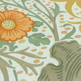 Close-up of the Seaweed Floral polyester cushion in Stone/Sunflower, showing a cream ground with sage-green foliage, an orange flowerhead and gold botanical detailing.