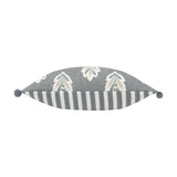 Sessile Leaf Reversible Cotton Cushion in Delph Blue, shown side-on with cream leaf print on one edge and blue-grey stripe on the other, finished with pom-pom corners on a white background.