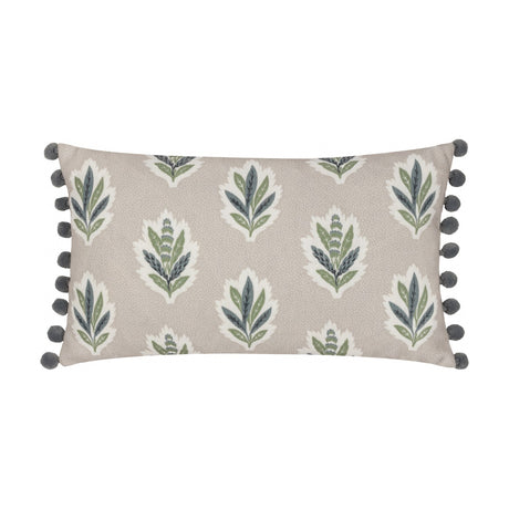 Sessile Leaf Reversible Cotton Cushion in Flax, rectangular bolster with grey pom-pom trim, featuring green and slate blue leaf sprig motifs on a flecked beige ground, shown on a white background.