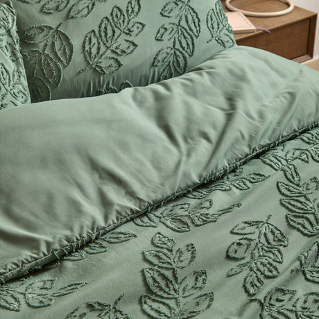 Seville Leaf Tufted Floral Duvet Cover Set in green, showing tufted leaf texture on the pillowcase and duvet in tone-on-tone polyester fabric, styled on a bed.